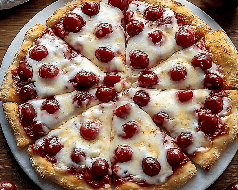 a cherry pie with crumbled toppings on it sitting on a table top